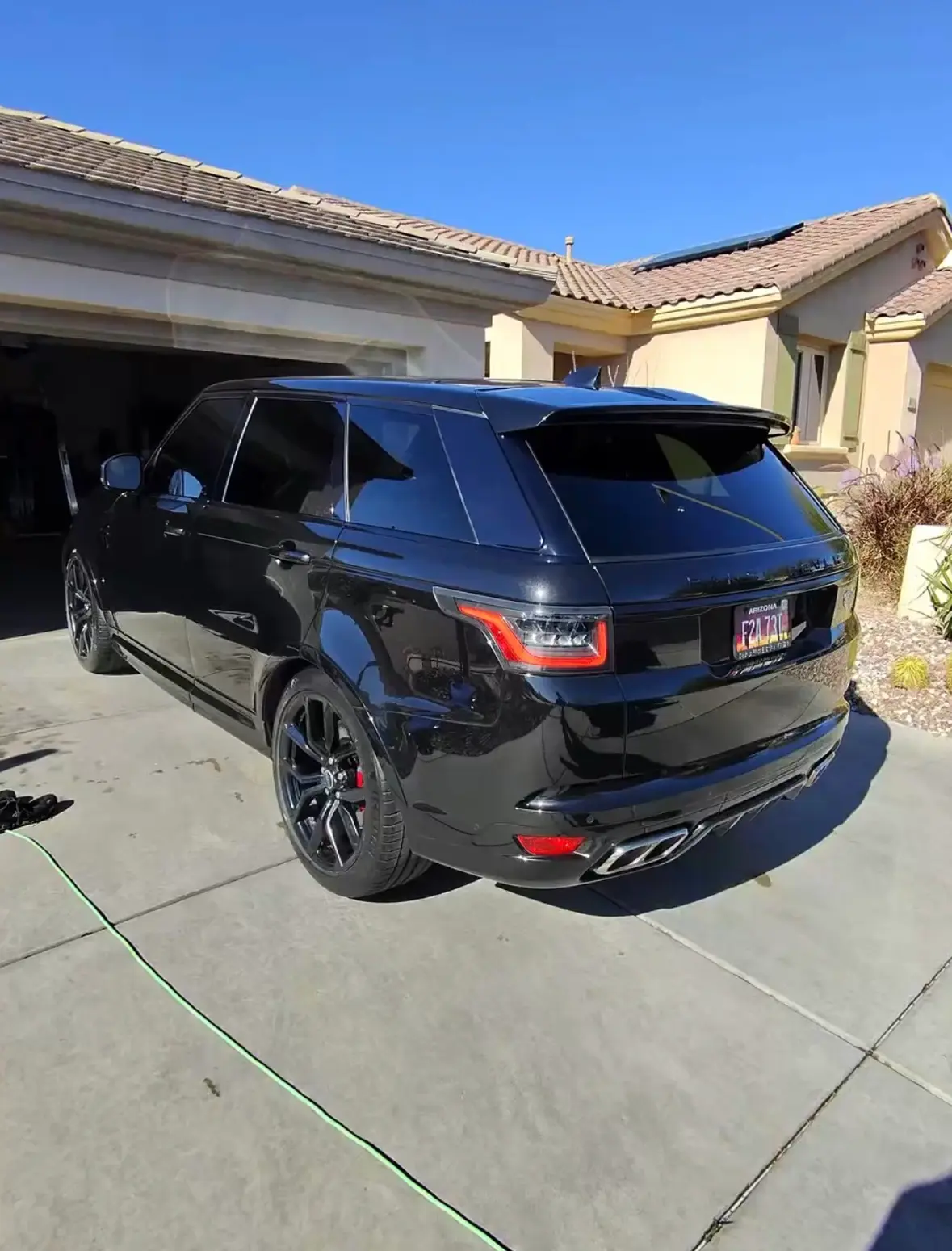 Standard detail on black Range Rover SUV in a Phoenix AZ driveway